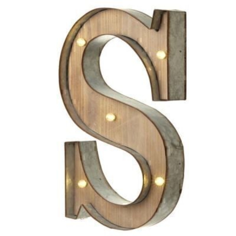 S Sign With LED Lights by Heaven Sends This S Sign With LED Lights by Heaven Sends could be paired with other letters to create a bespoke initial sign for a couple and or to be displayed on its own. Large in size this S sign has got LED lights and a switch on the side to turn it on. Made from wood and metal. Size: 27x5x41cm